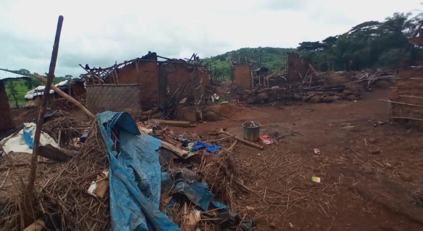 Charred debris litters the village after soldiers came through